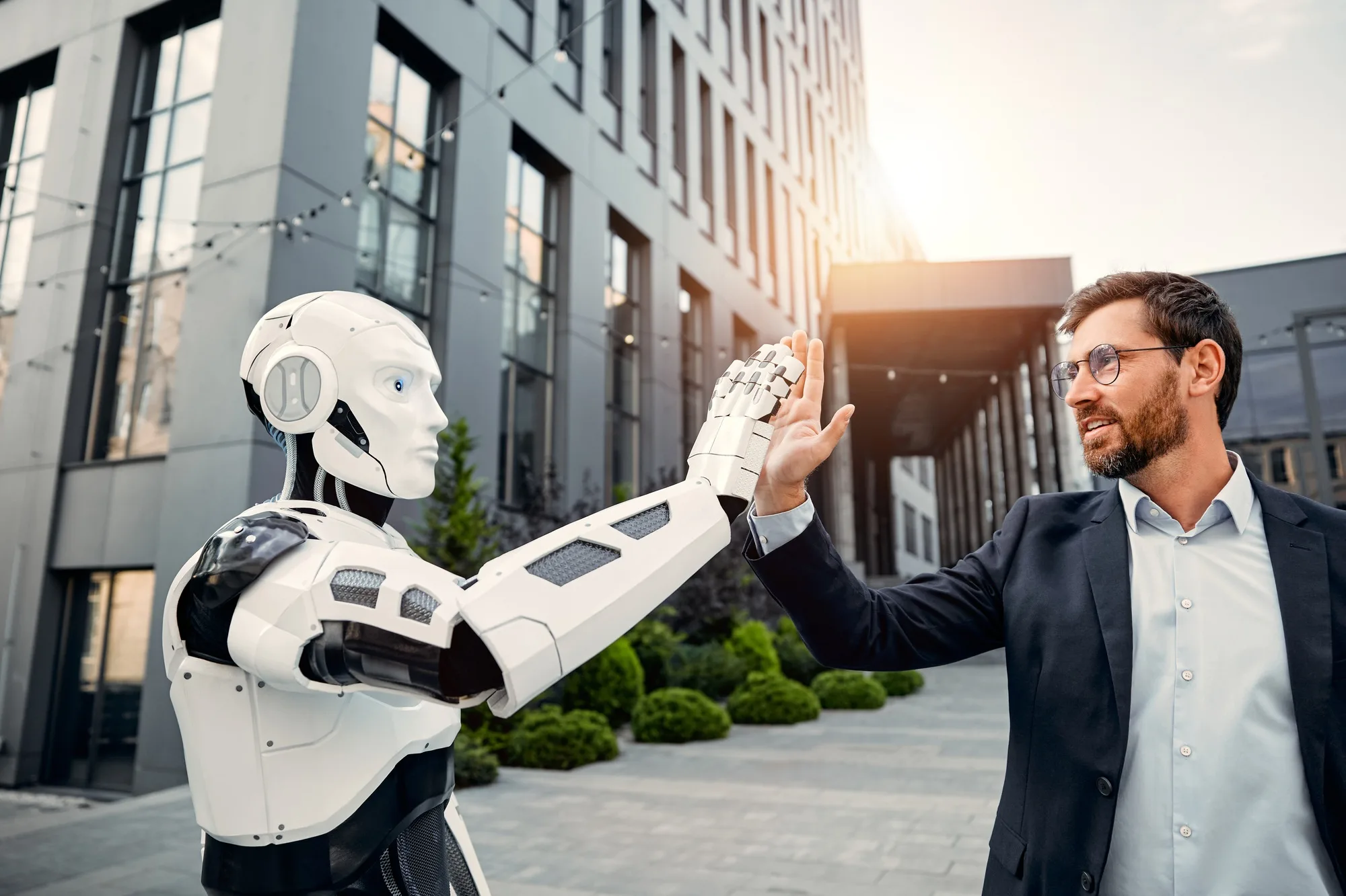Robot with businessmen on the street near the building